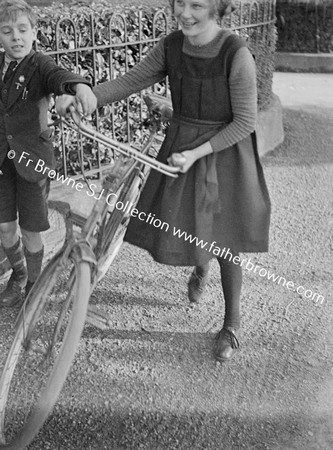 SHEILA COBBE WITH FR.BROWNE'S BIKE